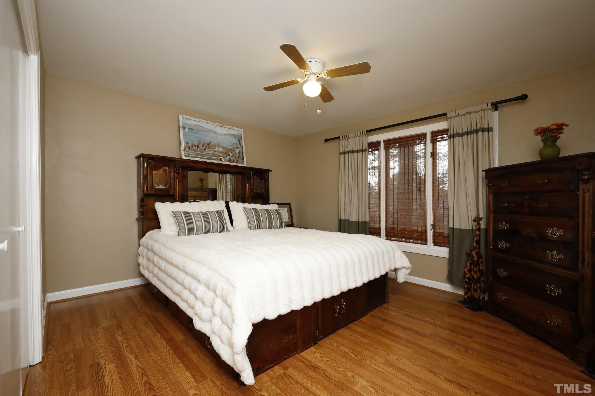 10904 Brass Kettle Road Raleigh, NC 27614 - Photo 29 of 41 a bed sitting in a bedroom and a dresser