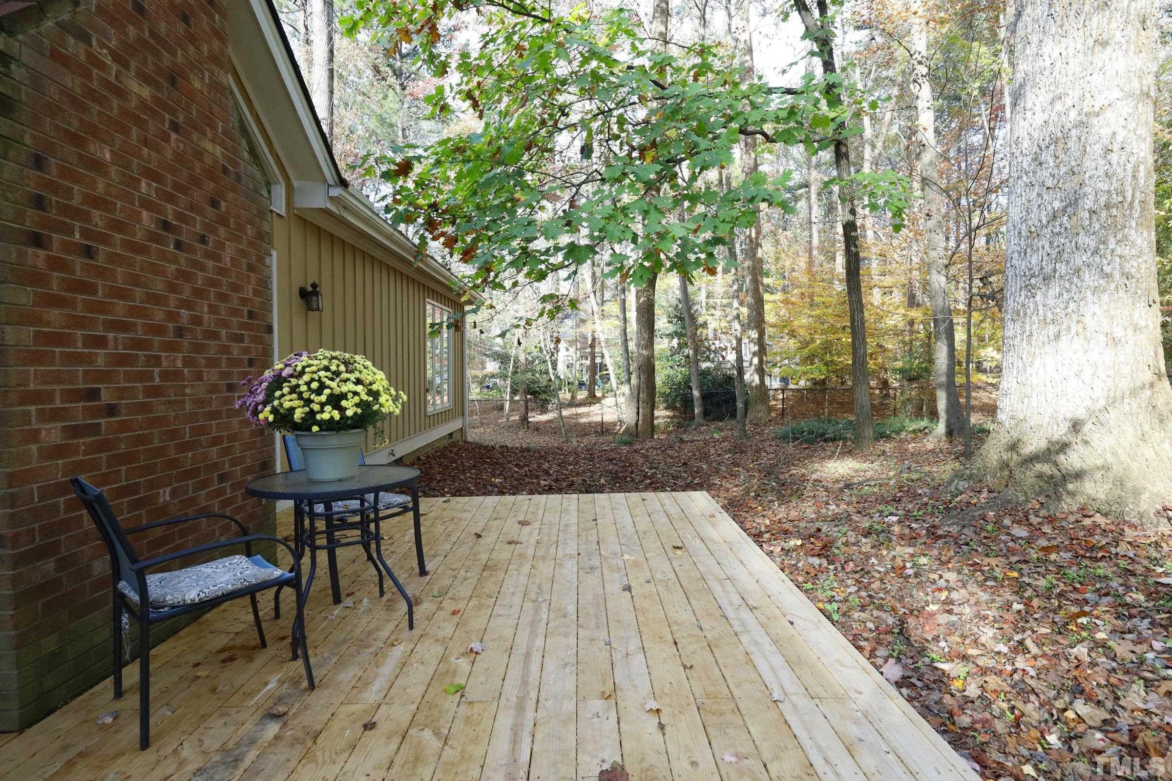 10904 Brass Kettle Road Raleigh, NC 27614 - Photo 34 of 41 a patio with table and chairs