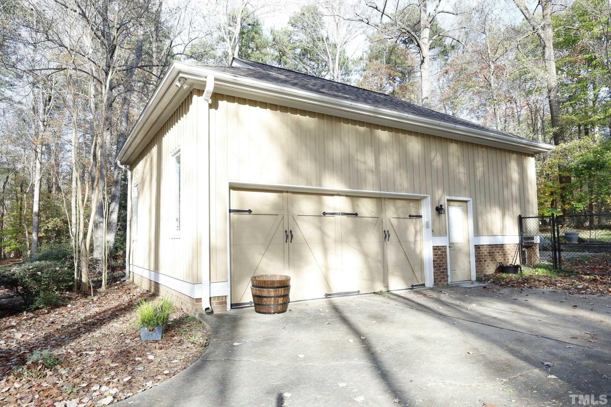 10904 Brass Kettle Road Raleigh, NC 27614 - Photo 6 of 41 a backyard of a house with table and chairs