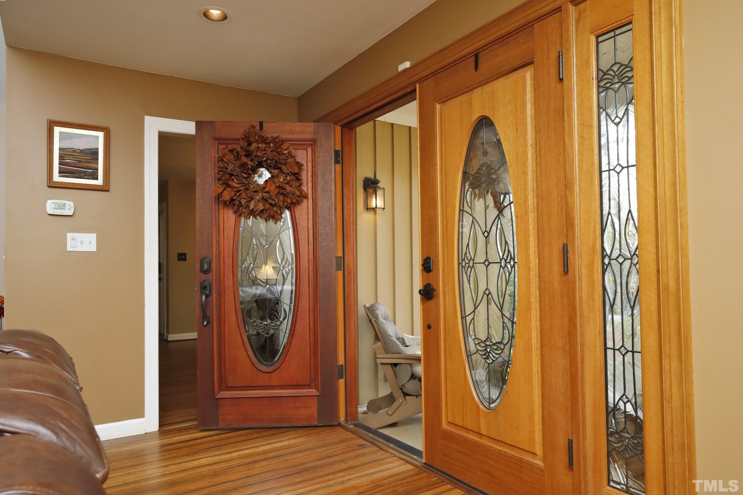 10904 Brass Kettle Road Raleigh, NC 27614 - Photo 10 of 41 a view of a entryway door with couch
