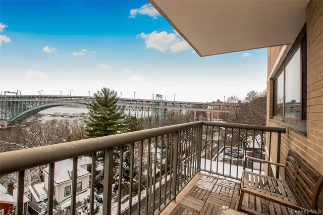 a view of balcony with furniture