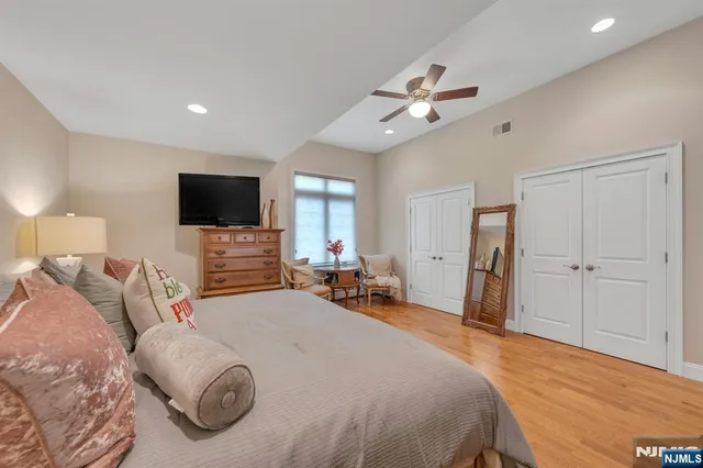a bathroom with a granite countertop sink mirror and a bath tub