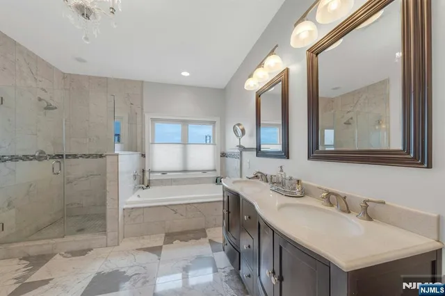 a bathroom with a bathtub and a shower