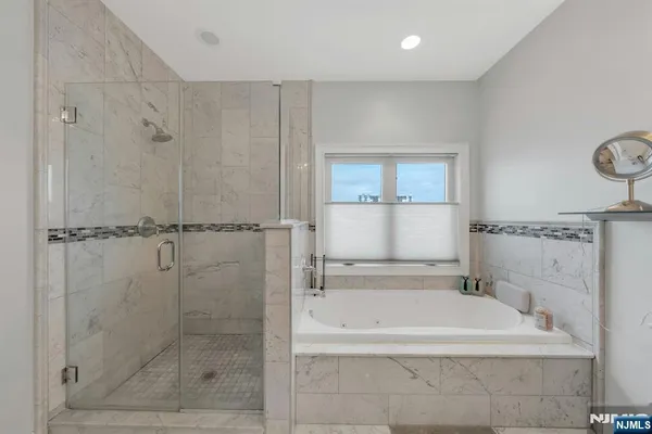 a bathroom with 2 sink and a mirror