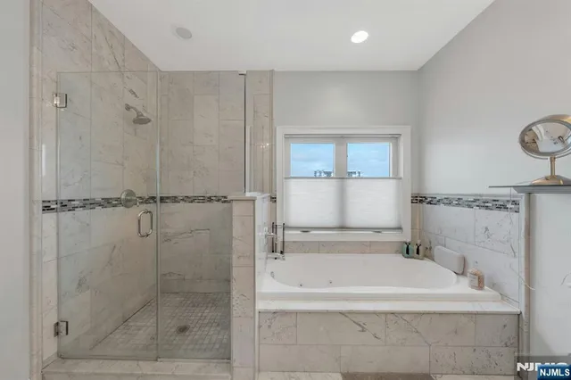 a bathroom with 2 sink and a mirror