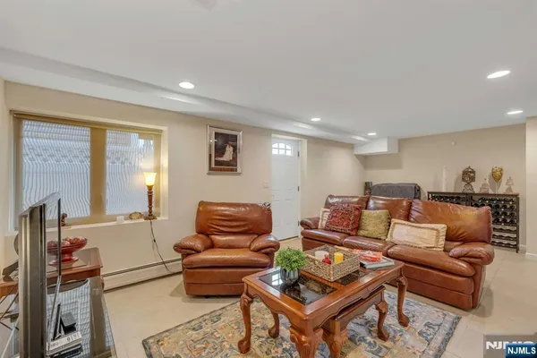 a view of a livingroom with workspace and a couch