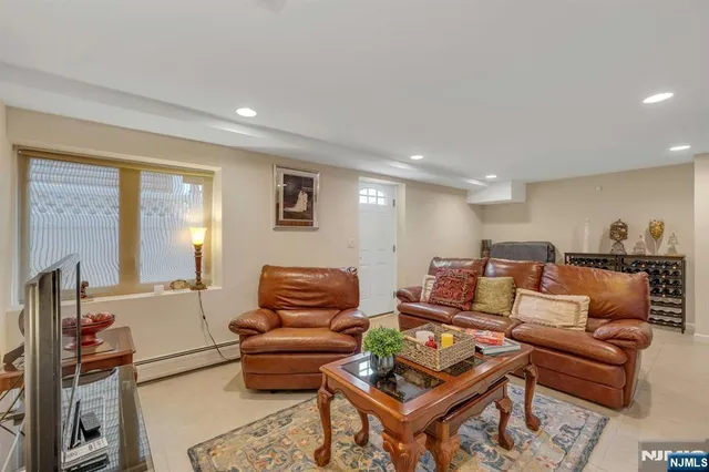 a view of a livingroom with workspace and a couch