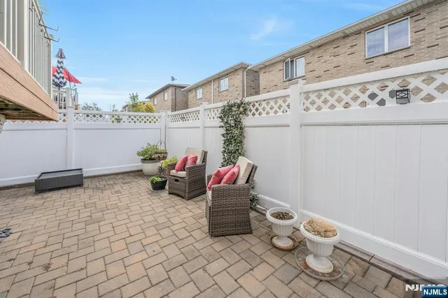 a front view of a house with many windows
