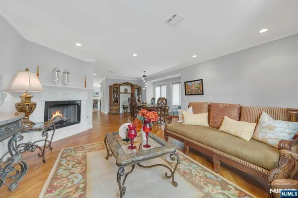 a livingroom with furniture wooden floor and windows