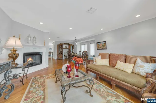 a livingroom with furniture wooden floor and windows