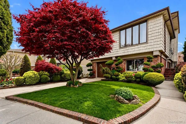 a view of a house with a backyard