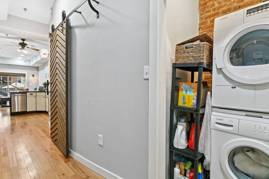 412 Monroe Street, Unit 2 Hoboken, NJ 07030 - Photo 11 of 16 a view of a hallway with washer and dryer