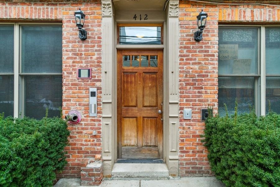 412 Monroe Street, Unit 2 Hoboken, NJ 07030 - Photo 16 of 16 a view of a brick building with a door and a window