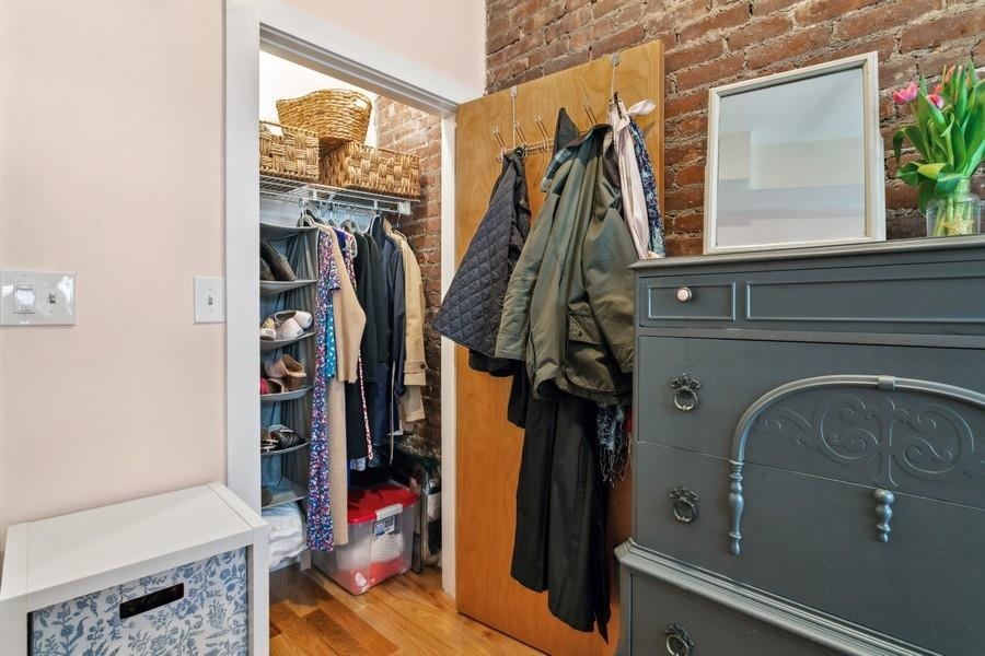 412 Monroe Street, Unit 2 Hoboken, NJ 07030 - Photo 9 of 16 a view of walk in closet with clothes and shoes