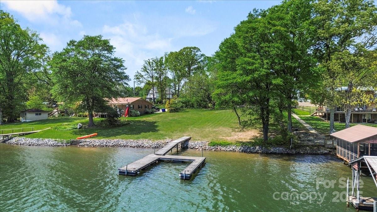 13 Normandy Road Denver, NC 28037 - Photo 8 of 14 an aerial view of a house with swimming pool a yard and lake view