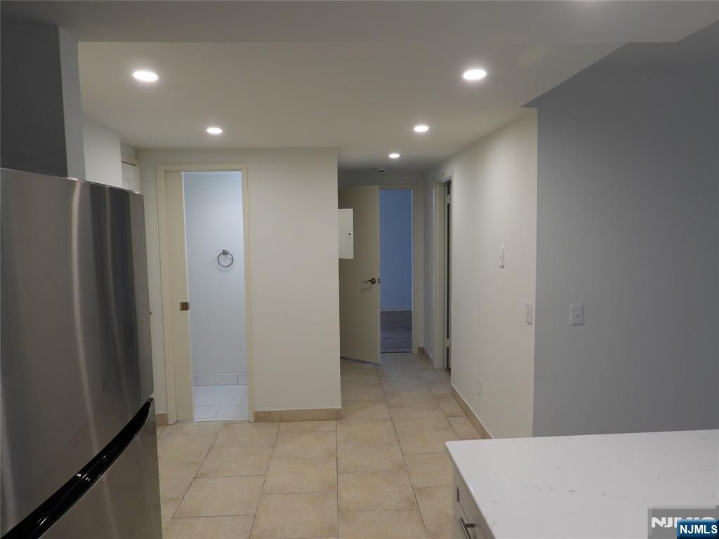 55 Clinton Place, Unit 301 Hackensack, NJ 07601 - Photo 10 of 17 a view of a hallway with stainless steel appliances
