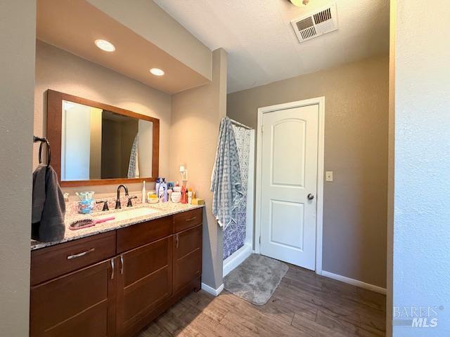 3110 Redemeyer Road Ukiah, CA 95482 - Photo 21 of 31 a bathroom with a double vanity sink and mirror