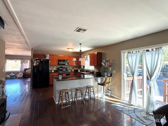 3110 Redemeyer Road Ukiah, CA 95482 - Photo 6 of 31 a kitchen with stainless steel appliances granite countertop a refrigerator dining table and chairs