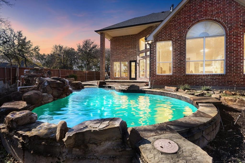 8306 Sawgrass Lane Rowlett, TX 75089 - Photo 35 of 35 a swimming pool with outdoor seating yard and barbeque oven