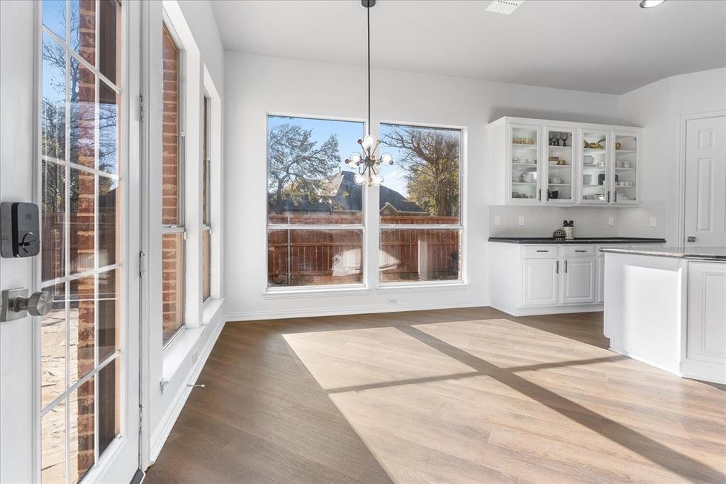 8306 Sawgrass Lane Rowlett, TX 75089 - Photo 9 of 35 a view of a kitchen with a sink and cabinets