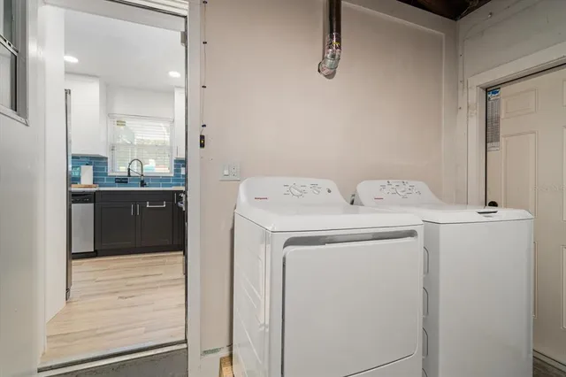 a utility room with dryer and washer