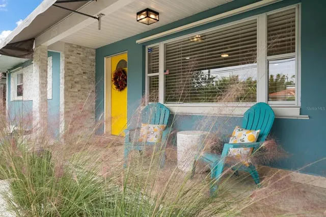 a swimming pool with outdoor seating and yard