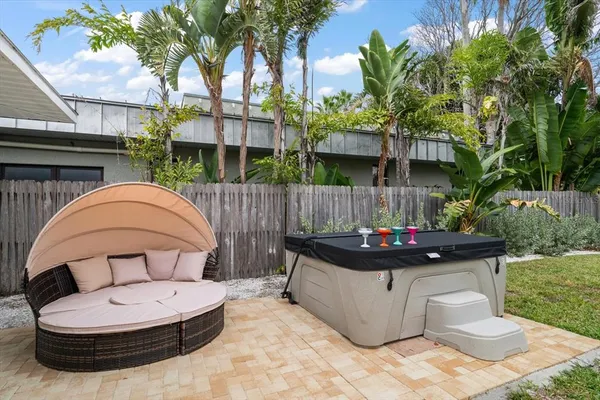 a view of a couches in patio of back yard