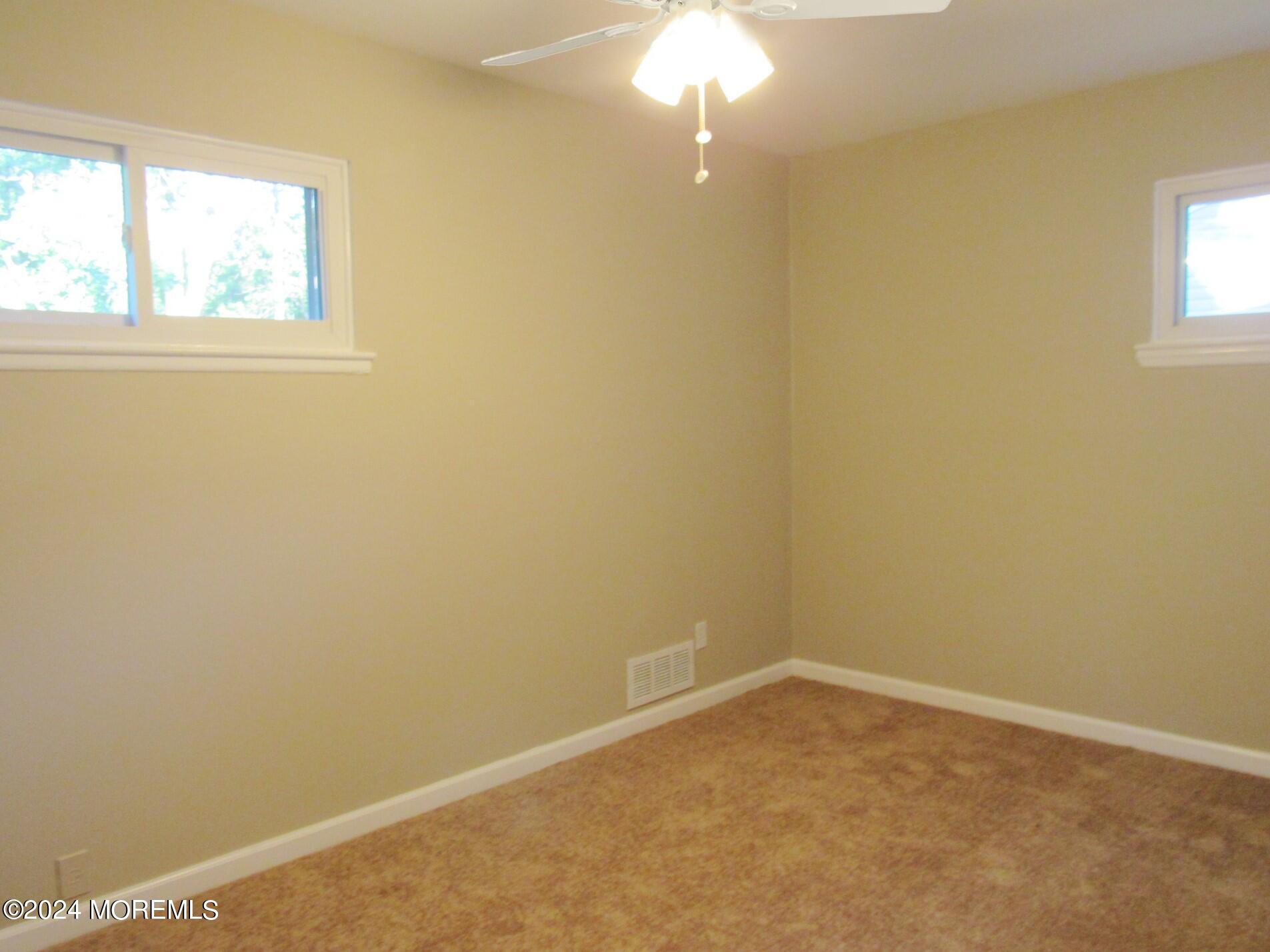 115 Solar Drive Brick, NJ 08724 - Photo 12 of 15 an empty room with a window