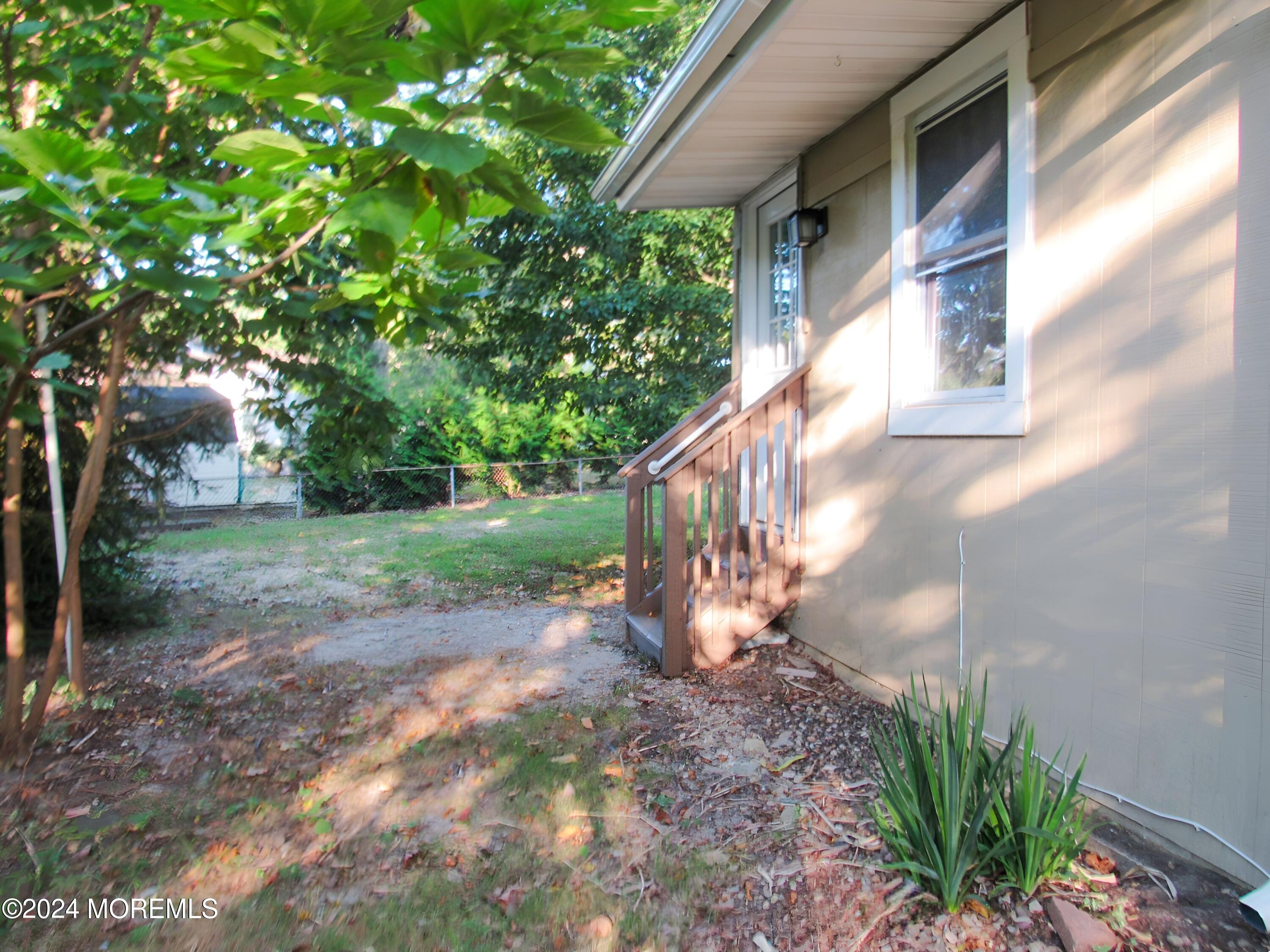 115 Solar Drive Brick, NJ 08724 - Photo 3 of 15 a view of a house with a yard