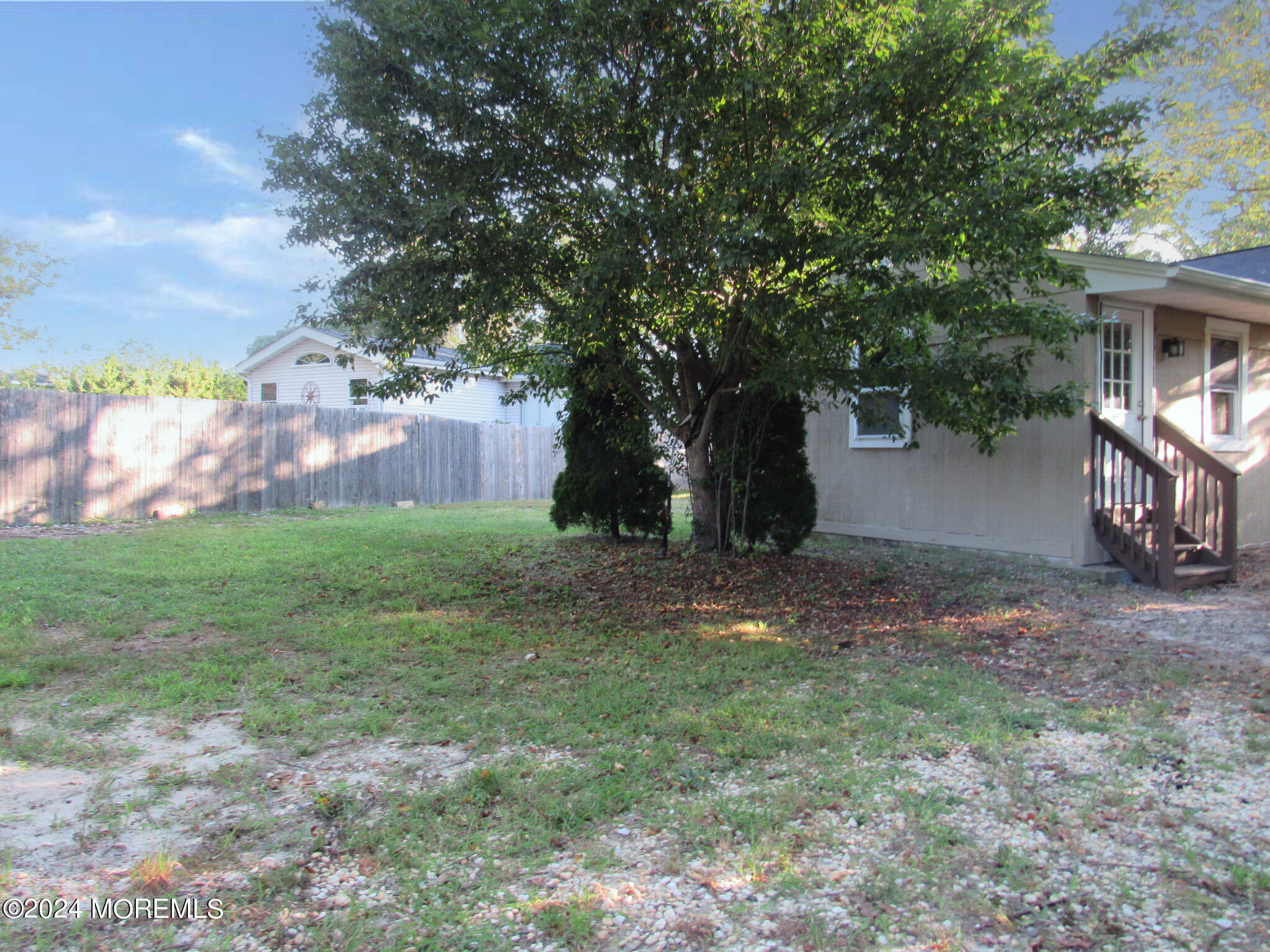 115 Solar Drive Brick, NJ 08724 - Photo 4 of 15 a view of a backyard with large trees