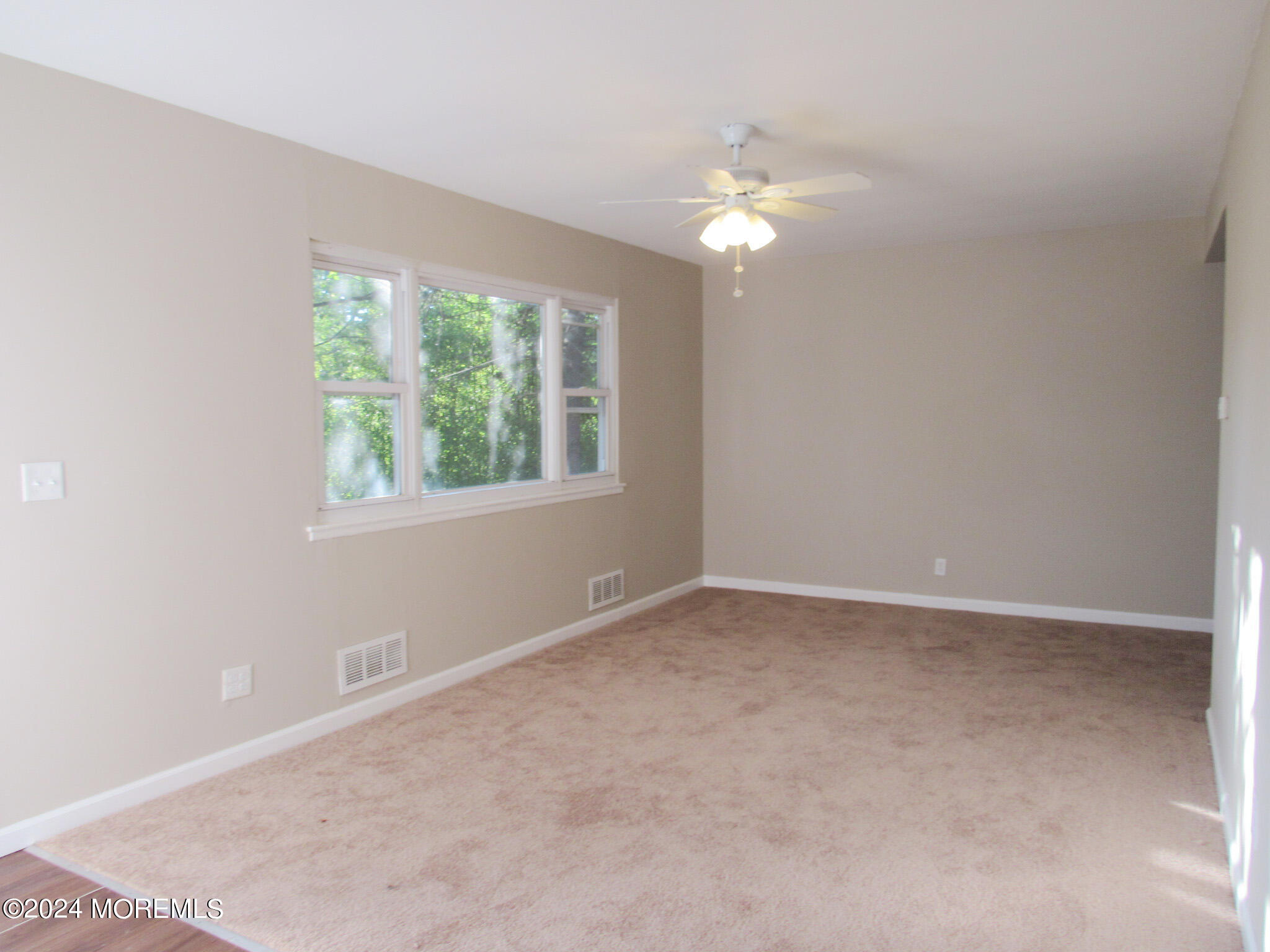 115 Solar Drive Brick, NJ 08724 - Photo 5 of 15 a view of an empty room with a window