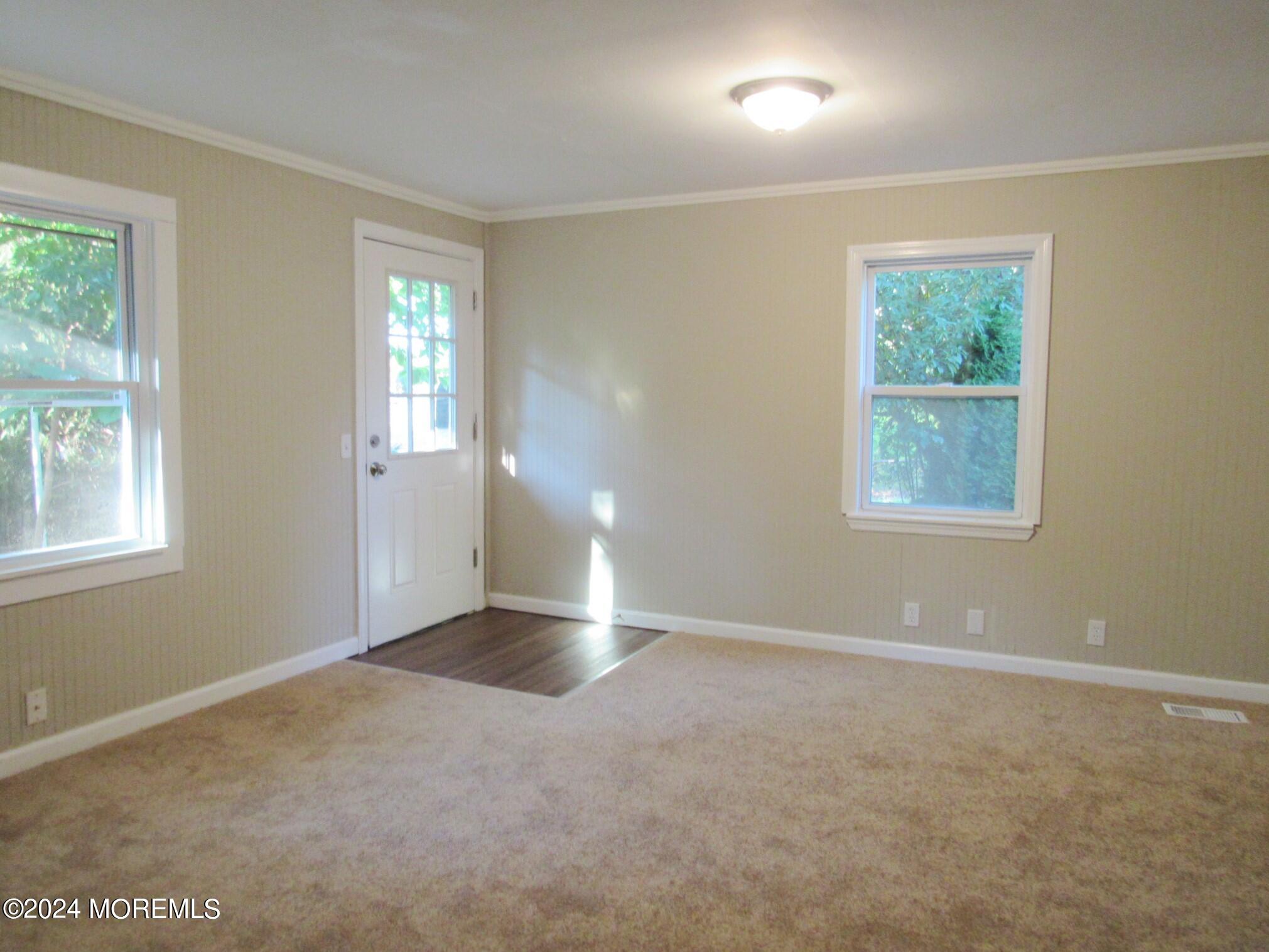 115 Solar Drive Brick, NJ 08724 - Photo 8 of 15 a view of an empty room with a window