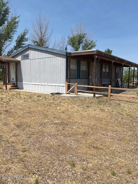 1165 West Antelope Run Road Paulden, AZ 86334 - Photo 2 of 5 a front view of a house with a yard