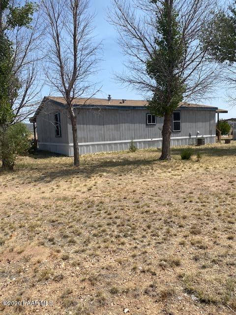 1165 West Antelope Run Road Paulden, AZ 86334 - Photo 3 of 5 a view of a house with a yard covered in snow