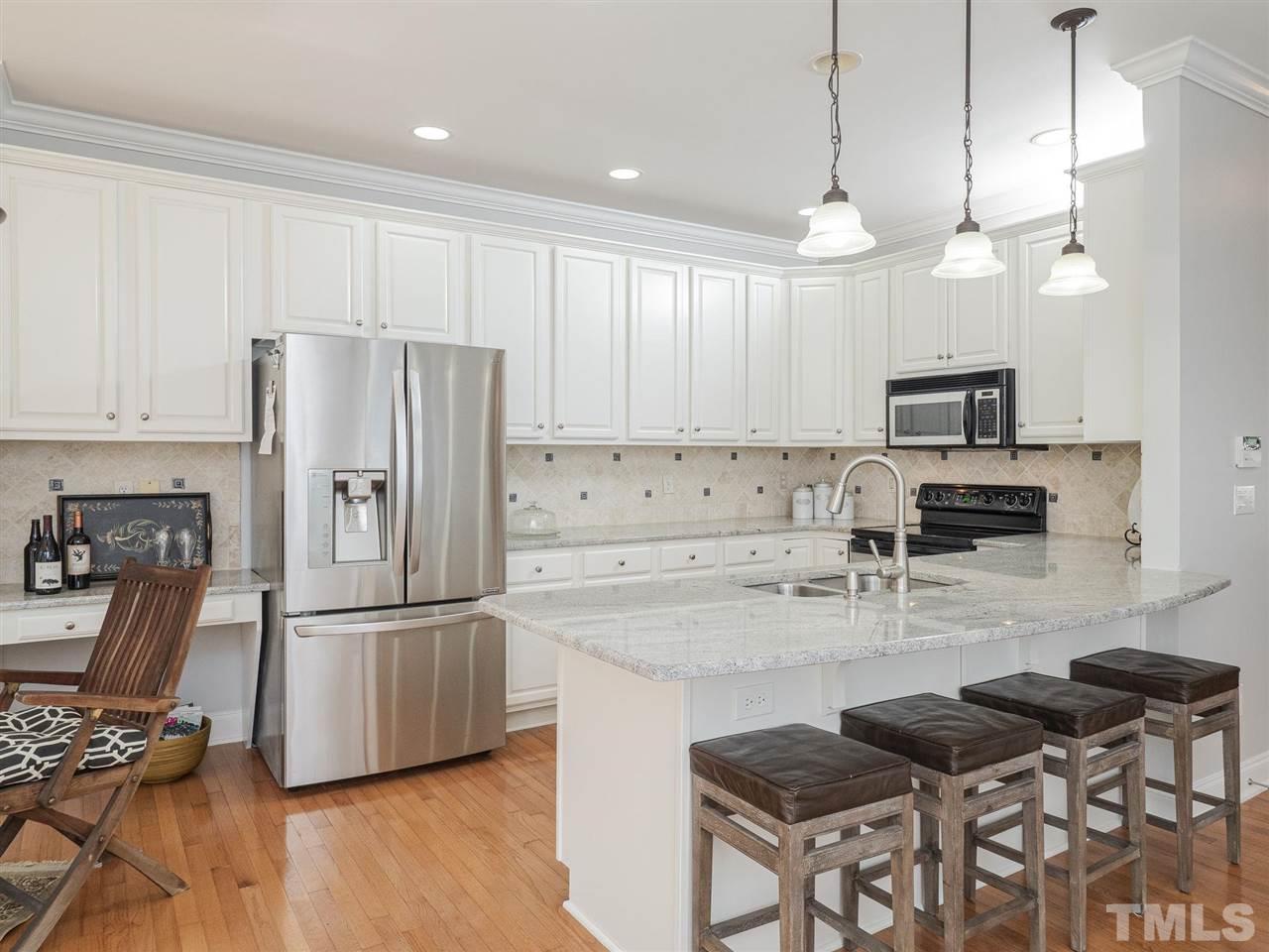 2318 St Paul's Square Raleigh, NC 27614 - Photo 11 of 25 kitchen with large breakfast bar