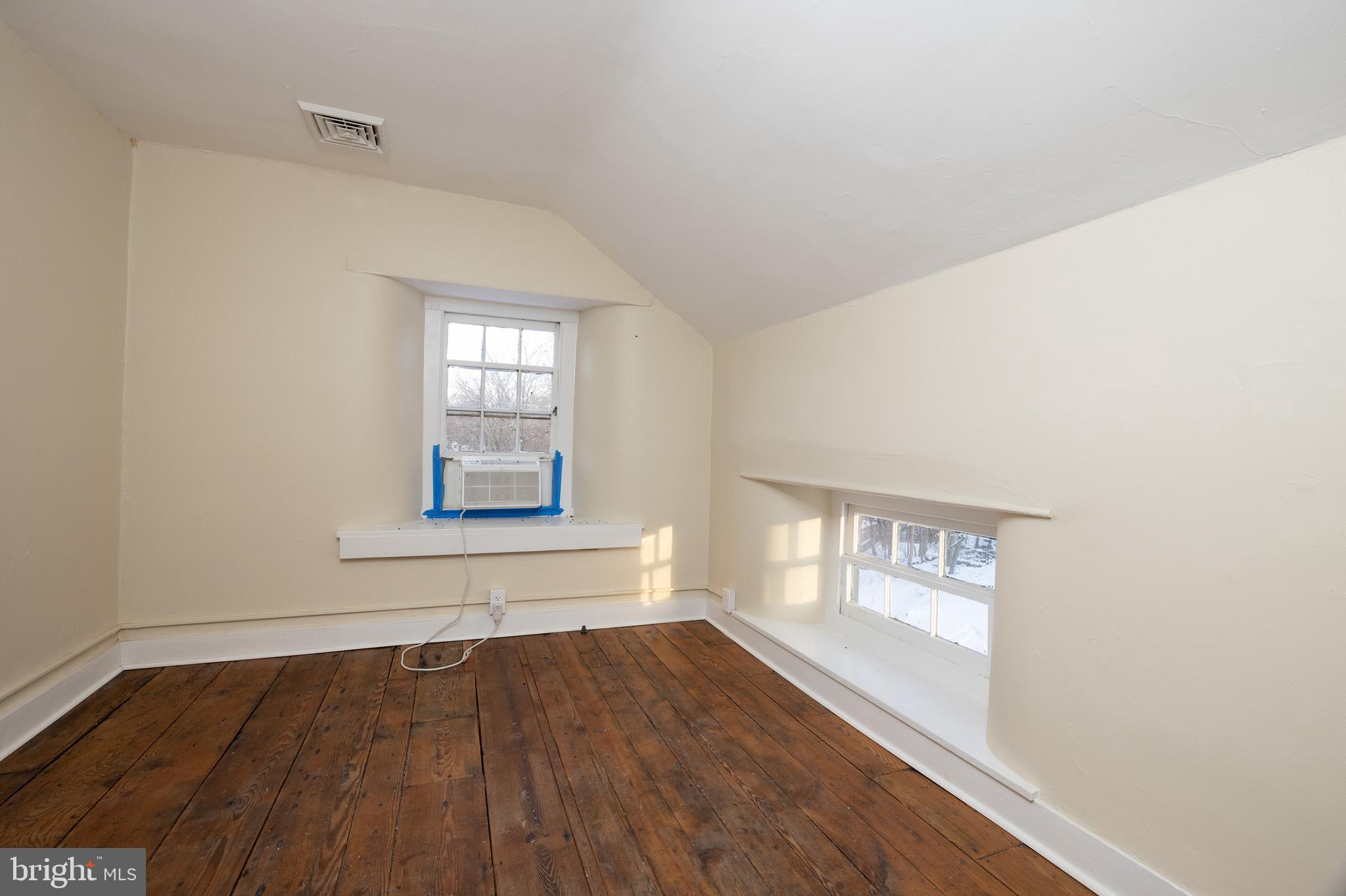 6192 Lower York Road, Unit B New Hope, PA 18938 - Photo 11 of 11 a view of an empty room with wooden floor and a window