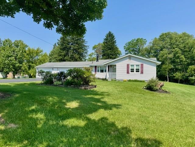 982 Smith Road New Castle, PA 16105 - Photo 1 of 29 a front view of a house with a yard and trees