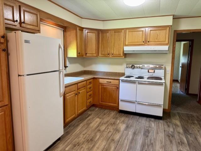 982 Smith Road New Castle, PA 16105 - Photo 3 of 29 a kitchen with a refrigerator a sink and dishwasher with wooden floor