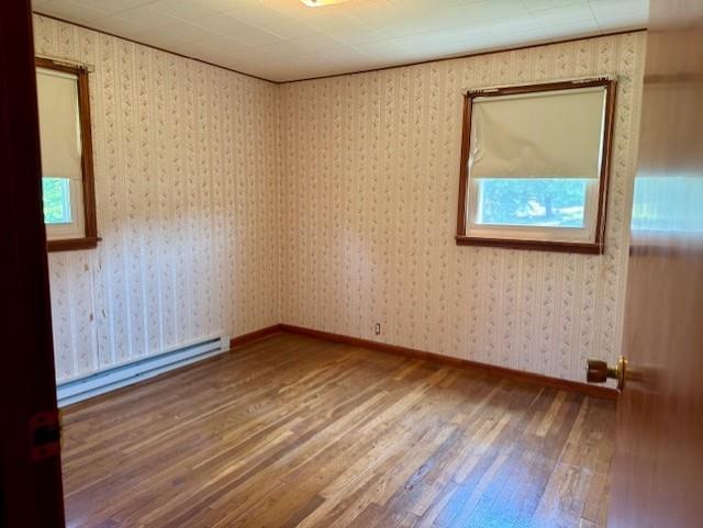 982 Smith Road New Castle, PA 16105 - Photo 10 of 29 a view of an empty room with wooden floor and a window