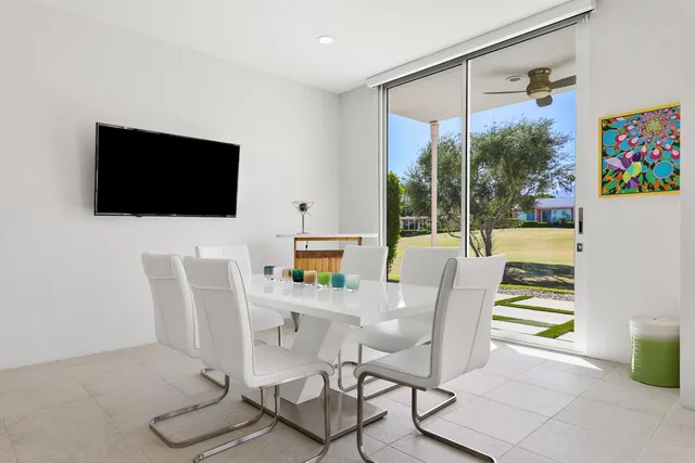 a view of a livingroom with furniture and a flat screen tv