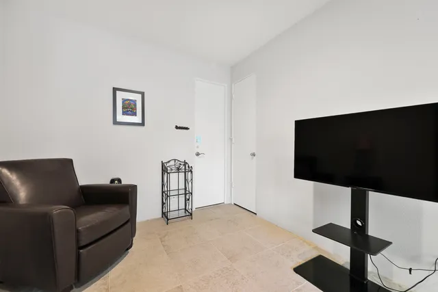 a view of a patio with swimming pool table and chairs