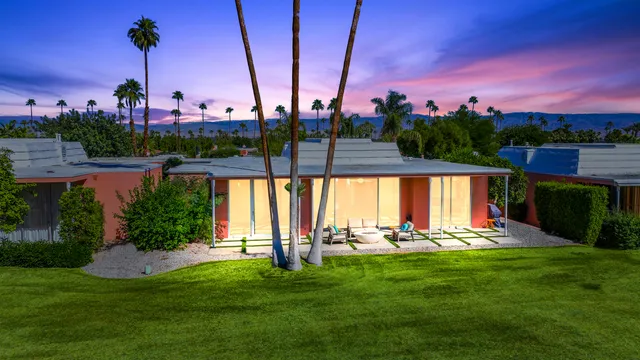 a view of an houses with a yard and lake view