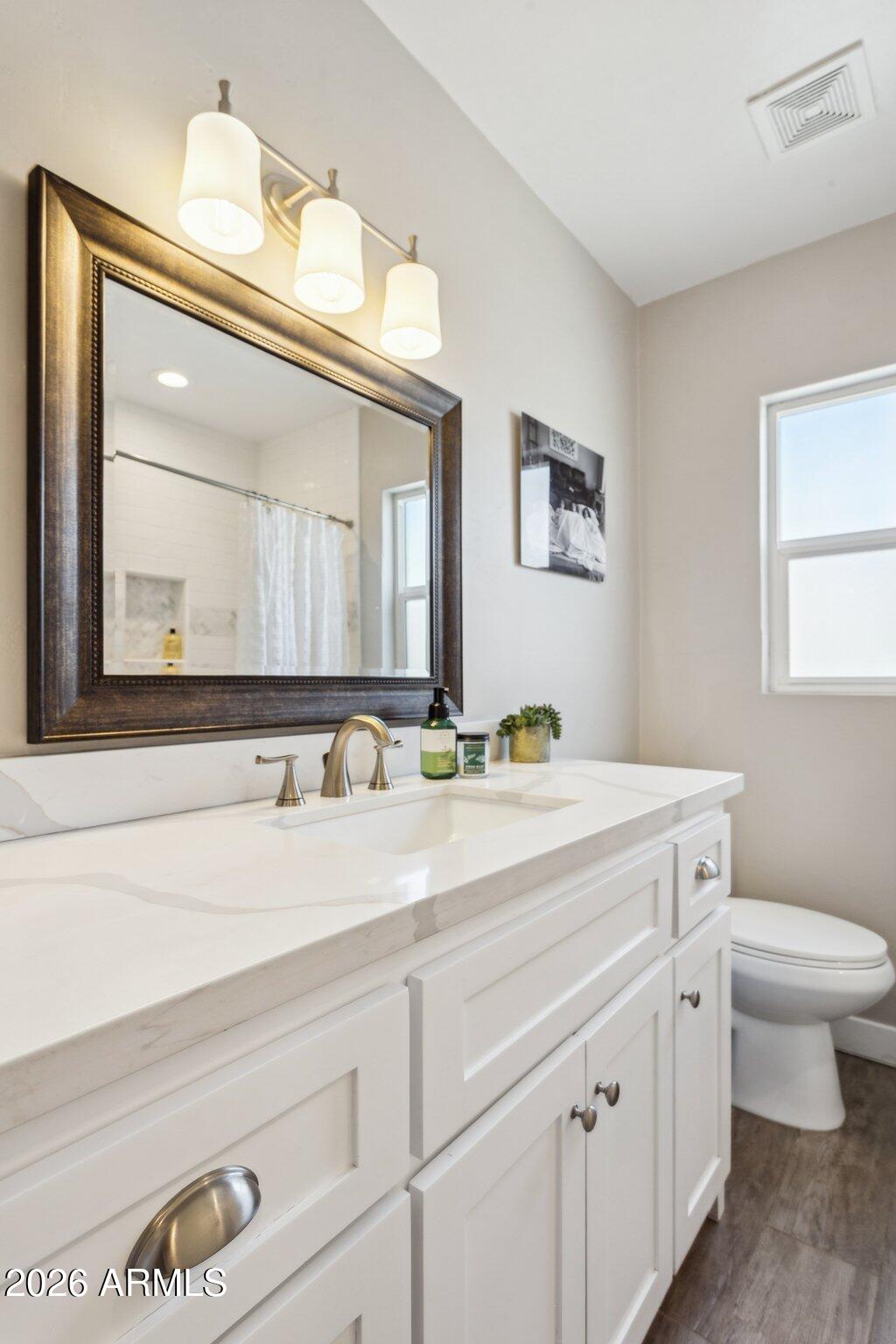 322 West Coronado Road Phoenix, AZ 85003 - Photo 64 of 93 a bathroom with a sink a toilet and a mirror