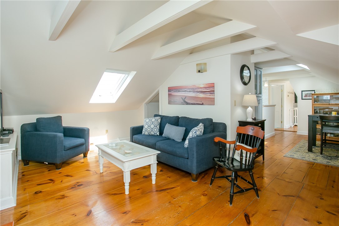 42 Kay Street, Unit 5 Newport, RI 02840 - Photo 1 of 34 Much character remains with wide plank wood flooring, exposed beams, cathedral ceilings and skylights.