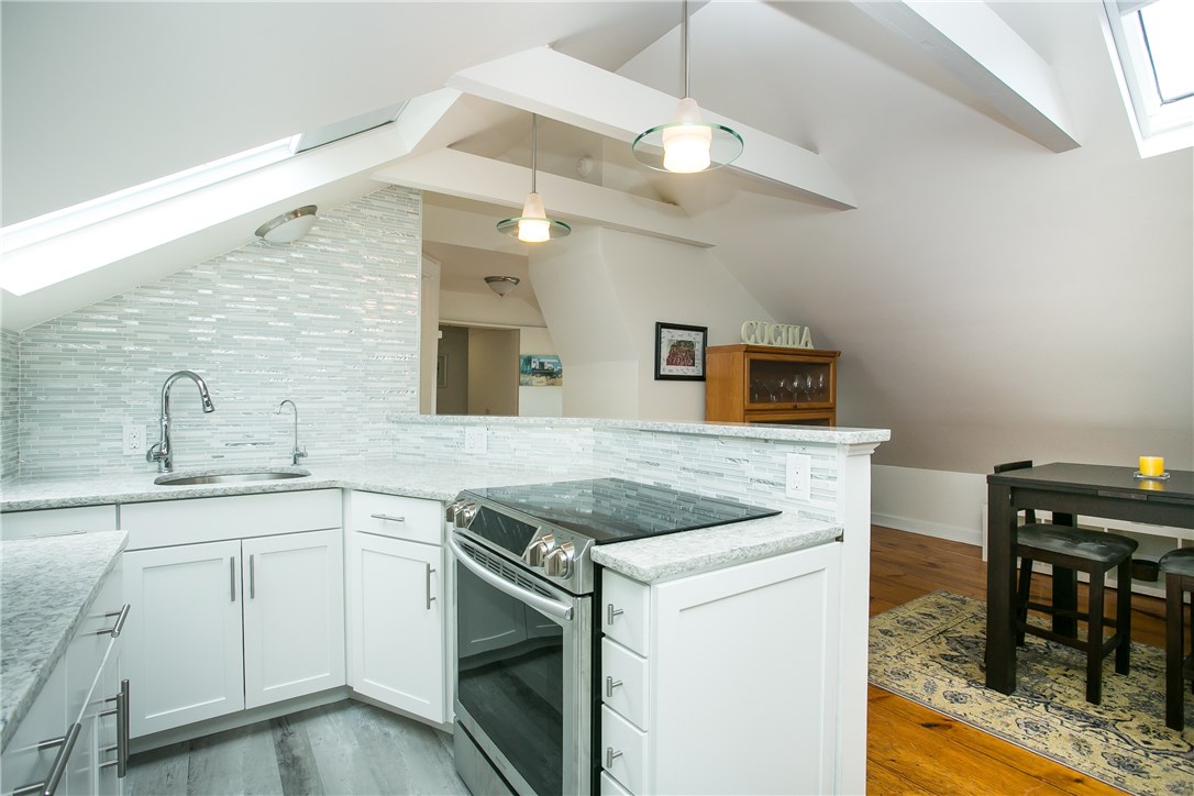 42 Kay Street, Unit 5 Newport, RI 02840 - Photo 15 of 34 Vaulted ceilings with skylights open up the space.
New kitchen remodeled in 2019.