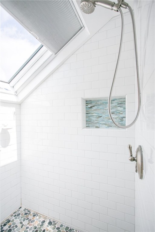 42 Kay Street, Unit 5 Newport, RI 02840 - Photo 21 of 34 White subway tiles, pebble tiles on floor and glass tiles in recess keep this space light and bright. The skylight allows for light as well as ventilation. All the skylights have room darkening screens.