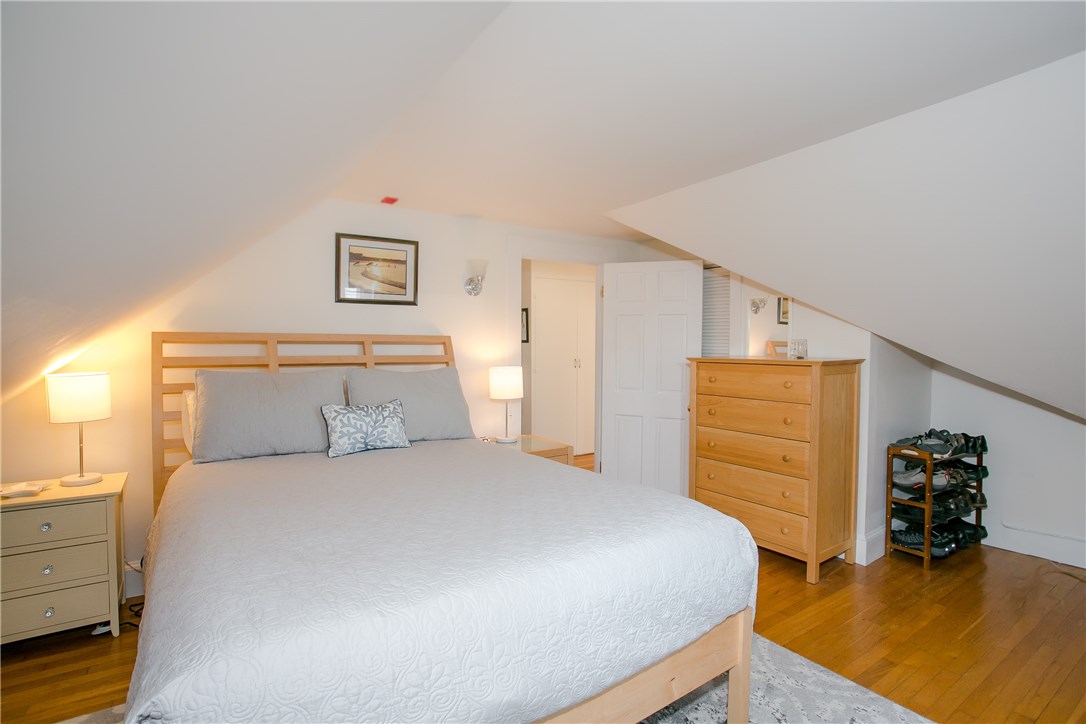 42 Kay Street, Unit 5 Newport, RI 02840 - Photo 25 of 34 Master bedroom with closet to the right of the doorway. Additional storage under the eaves. Measures approximately 11.11 x 16