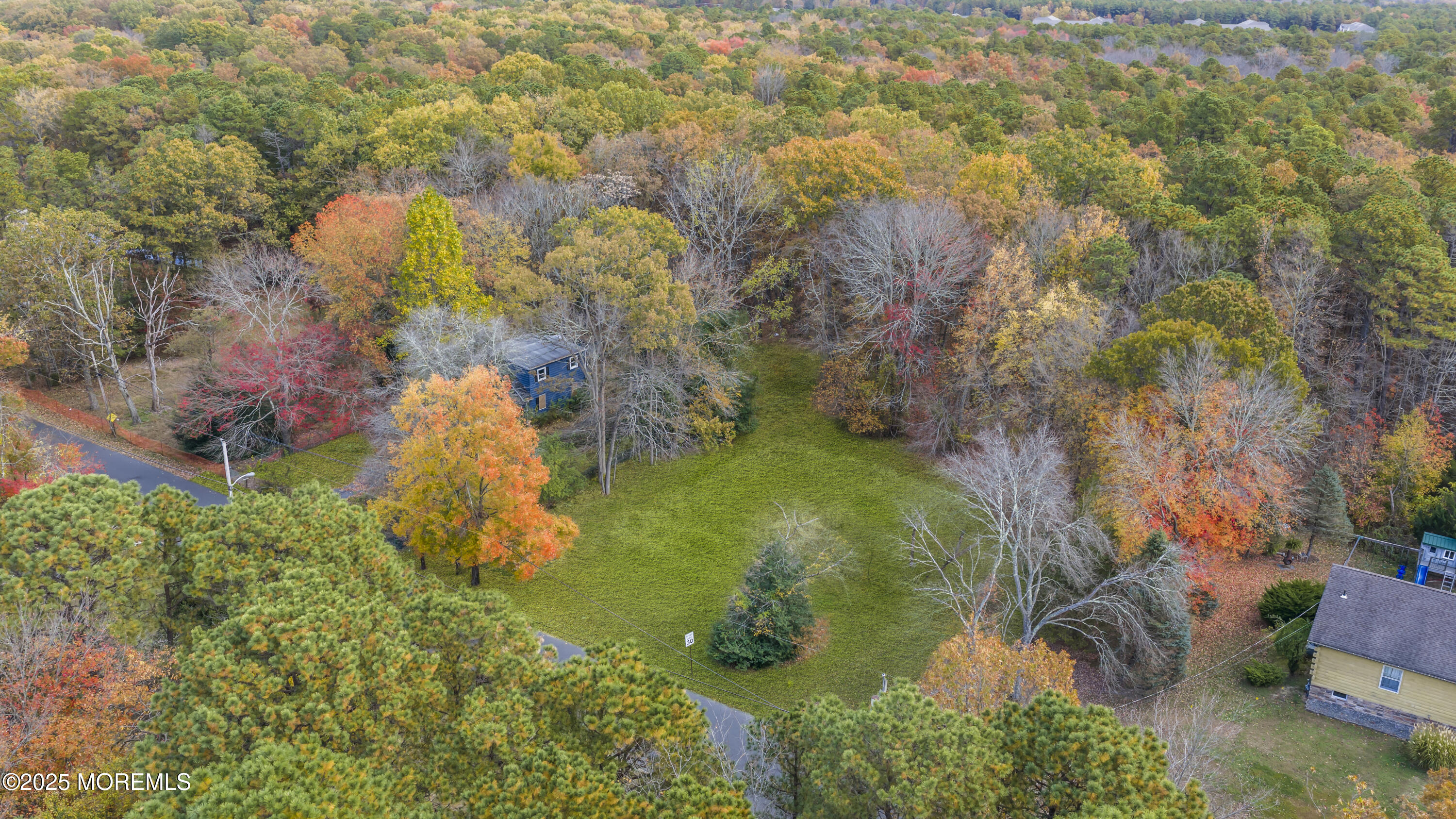 a backyard of a house with lots of green space