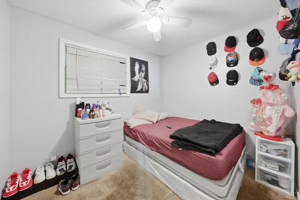 a room with toys and dresser with wooden floor