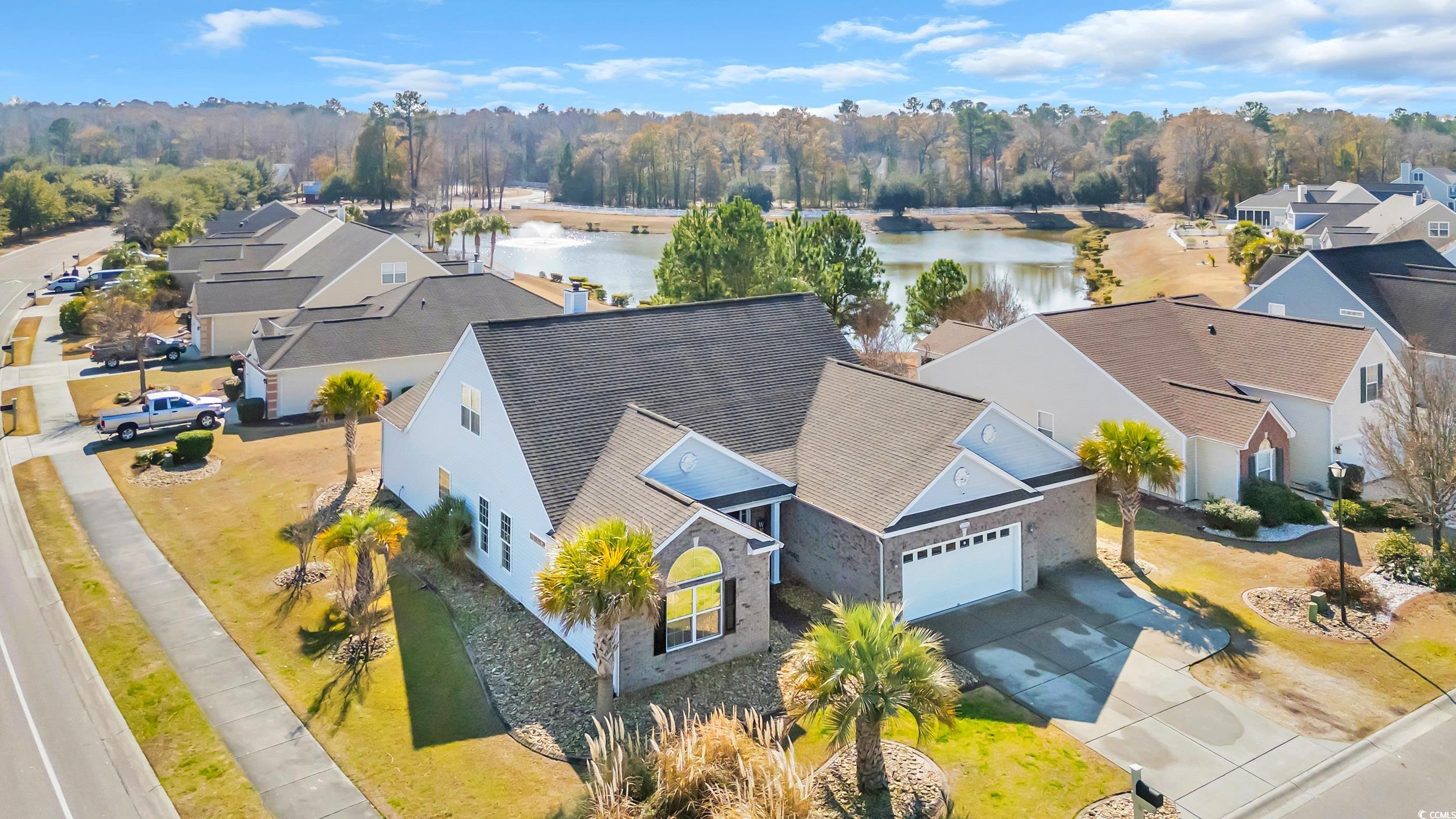 Drone / aerial view with a water view and a Corner